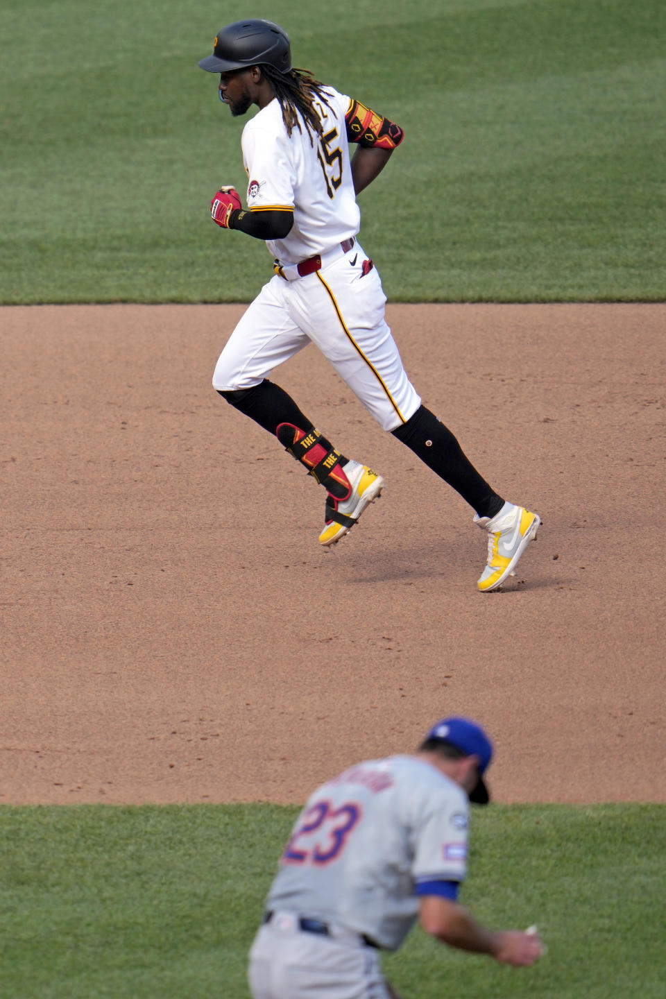 Pittsburgh Pirates' Oneil Cruz (15) rounds the bases after hitting a two-run home run off New York Mets starting pitcher David Peterson (23) during the fourth inning of a baseball game in Pittsburgh, Saturday, July 6, 2024. (AP Photo/Gene J. Puskar)