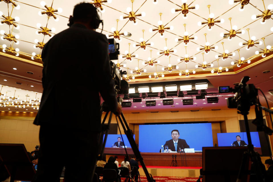 Guo Weimin, Vice Minister of the State Council Information Office of China, addresses the media on Wednesday. Source: Getty