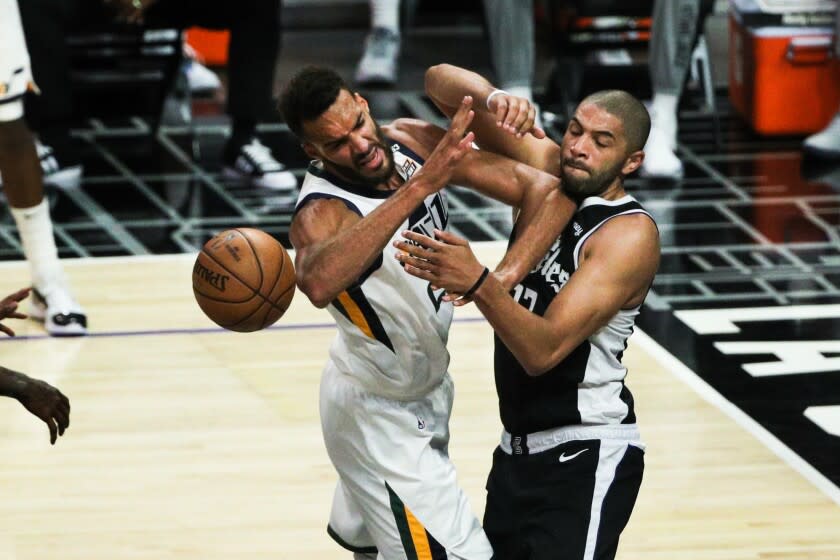 LA Clippers forward Nicolas Batum (33) plays tight defense on Utah Jazz center Rudy Gobert (27)