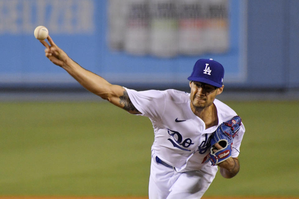 Los Angeles Dodgers relief pitcher Joe Kelly throws to the plate during the eighth inning of a baseball game against the San Francisco Giants Friday, Aug. 7, 2020, in Los Angeles. (AP Photo/Mark J. Terrill)