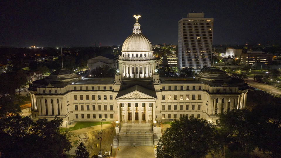 The Mississippi State Capitol is illuminated in Jackson, Miss., Thursday, Sept. 1, 2022. On Friday, Sept. 2, The Associated Press reported on stories circulating online incorrectly claiming a video that shows a tanker truck outside the governor’s mansion in Jackson, supplying the residence with water amid the city’s water crisis.(AP Photo/Steve Helber)