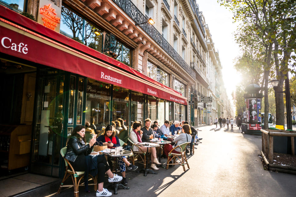 Paris, France - September 25, 2016: People relaxing, eating and drinking in restaurant in Paris