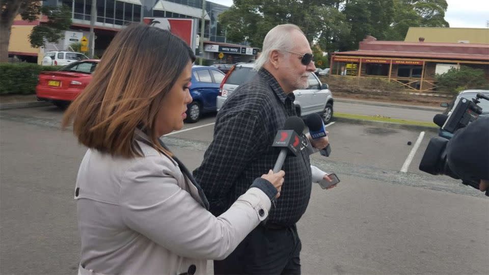 7 News reporter Leonie Ryan speaks to Chris Nelson at the front of Gosford Local Court and is pleading guilty for using a carriage service to cause offence. Photo: ABC