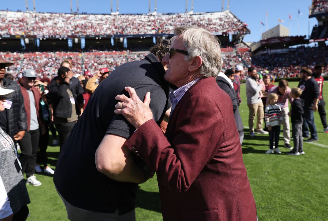 Former South Carolina coach Steve Spurrier is greeted by former players during halftime of the Gamecocks’ game at Williams-Brice Stadium in Columbia on Saturday, November 4, 2023.