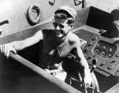 <p>Lt. j.g. John F. Kennedy aboard the PT-109 torpedo boat in the South Pacific in 1943. (Photo: John F. Kennedy Presidential Library and Museum) </p>