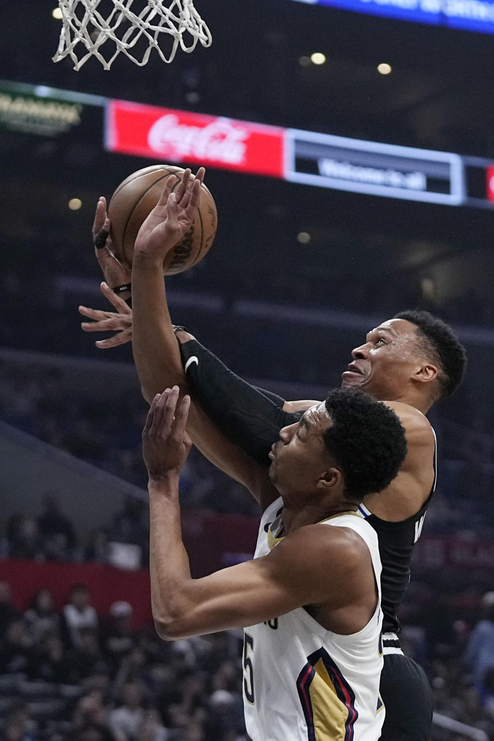 Los Angeles Clippers guard Russell Westbrook, top, shoots as New Orleans Pelicans guard Trey Murphy III defends during the first half of an NBA basketball game Saturday, March 25, 2023, in Los Angeles. (AP Photo/Mark J. Terrill)