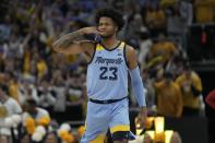 Marquette's David Joplin reacts to his three-pointer during the second half of an NCAA college basketball game against Wisconsin Saturday, Dec. 3, 2022, in Milwaukee. Wisconsin won 80-77 in overtime. (AP Photo/Morry Gash)