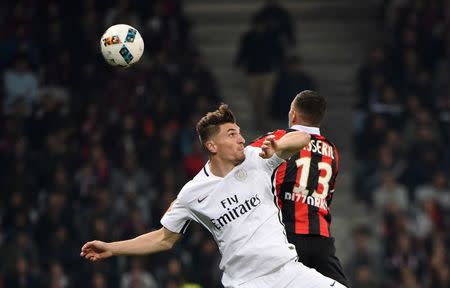 Football Soccer - Nice v Paris St Germain - French Ligue 1 - Allianz Riviera Stadium, Nice, France, 30/04/2017. Paris St Germain's Thomas Meunier (L) in action with Nice's Valentin Esseyric. REUTERS/Jean-Pierre Amet