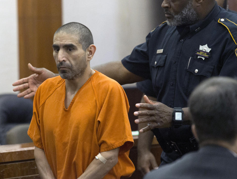 FILE - Robert Solis, accused in the shooting death of Harris County Deputy Sandeep Dhaliwal, appears for Judge Chris Morton at the Harris County Criminal Courthouse on Sept. 30, 2019, in Houston. Solis was convicted of capital murder on Monday, Oct. 17, 2022, in the 2019 shooting death of the law enforcement officer who was the first Sikh deputy in his Texas agency. (Yi-Chin Lee/Houston Chronicle via AP, File)