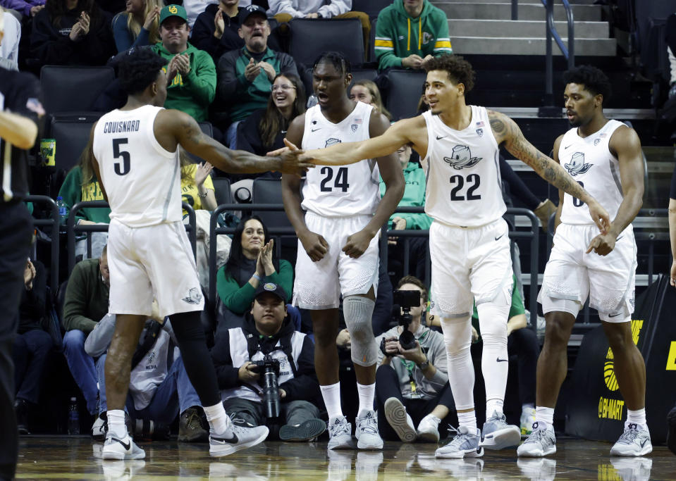 Oregon guard Jadrian Tracey (22) celebrates with Oregon guard Jermaine Couisnard (5) during the second half of an NCAA college basketball game in Eugene, Ore., Saturday, Jan. 13, 2024. (AP Photo/Thomas Boyd)