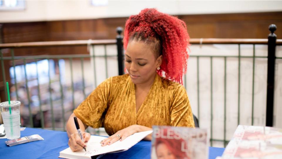 Kim Fields signs copies of her book 