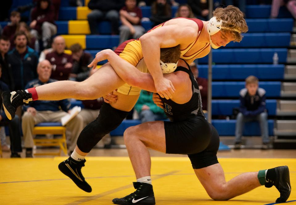 Castle's John Purdy, bottom, and Mater Dei's Gabe Sollars compete in the 195-pound championship match during the IHSAA Wrestling Regional at Castle High School in Paradise, Ind., Saturday afternoon, Feb. 5, 2022. Sollars won a 5-0 decision.