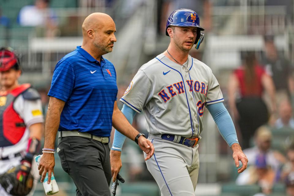 New York Mets first baseman Pete Alonso (20) leaves the game after being hit by a pitch against the Atlanta Braves during the first inning on June 7, 2023, at Truist Park.
