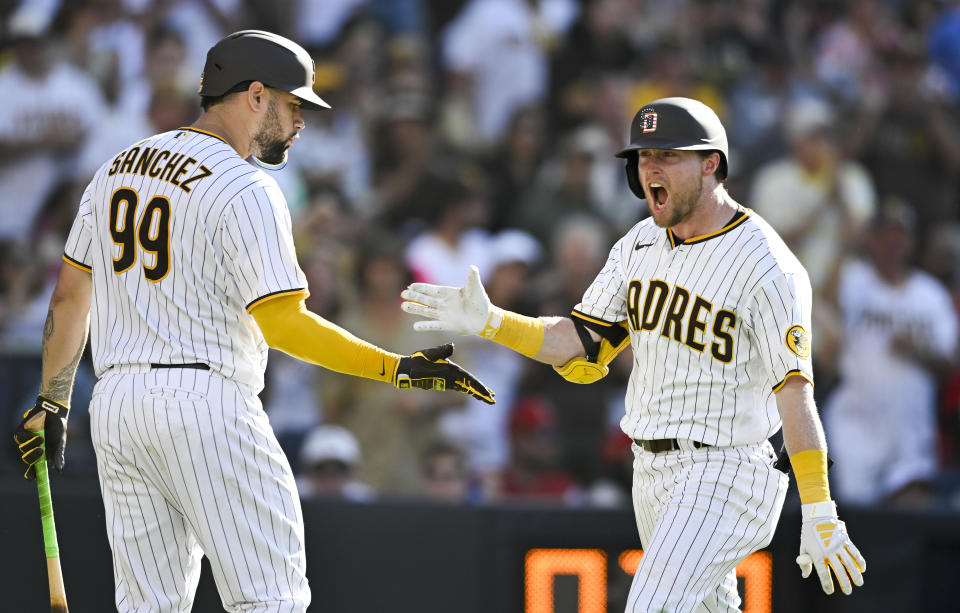 San Diego Padres' Jake Cronenworth, right, is congratulated by Gary Sanchez after hitting a solo home run against the Los Angeles Angels during the sixth inning of a baseball game Tuesday, July 4, 2023, in San Diego. (AP Photo/Denis Poroy)