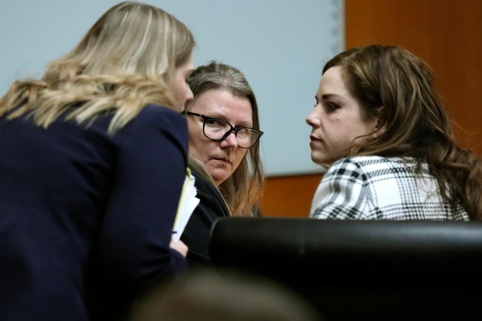 Jennifer Crumbley, center, listens to her attorneys in the Oakland County courtroom Feb. 2, 2024, in Pontiac, Mich.