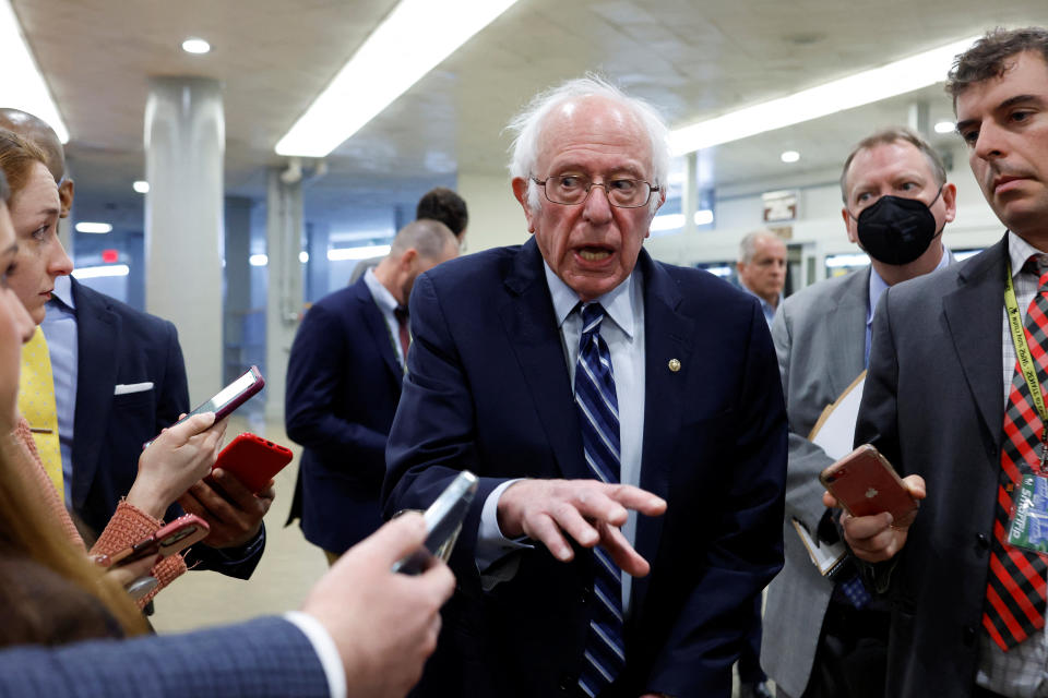 U.S. Senator Bernie Sanders (I-VT) is trailed by reporters as he arrives for the weekly Democratic caucus luncheon at the U.S. Capitol in Washington, U.S. November 29, 2022.  REUTERS/Jonathan Ernst