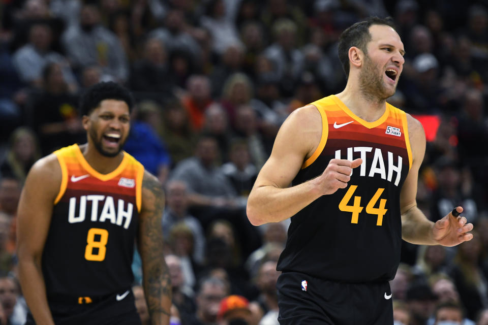 Utah Jazz forward Rudy Gay (8) and forward Bojan Bogdanovic (44) react to a play during the first half of the team's NBA basketball game against the New Orleans Pelicans on Saturday, Nov. 27, 2021, in Salt Lake City. (AP Photo/Alex Goodlett)