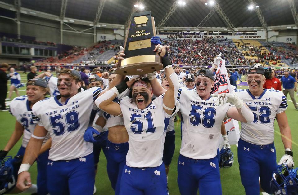 Van Meter football team celebrates after winning 24-21 over Central Lyon-George/Little Rock in the class 2A Iowa High School football championship game at UNI Dome on Friday, Nov. 17, 2023, in Cedar Falls, Iowa.