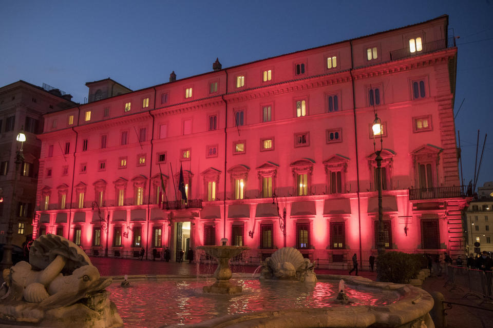 Chigi Palace Italian government's office is illuminated in red on the occasion of International Day for the Elimination of Violence against Women, in Rome, Wednesday, Nov. 25, 2020. (Roberto Monaldo/LaPresse via AP)