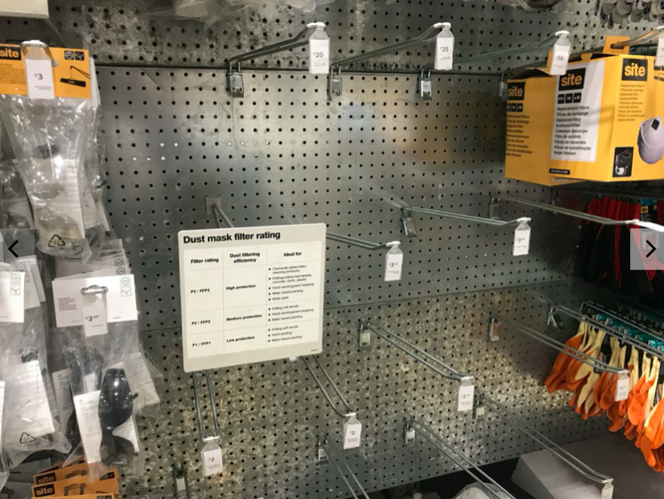 Empty racks where face masks are usually sold at a DIY store in west London (PA)