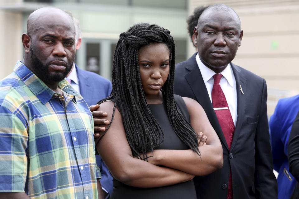 Michael McGlockton, from left, Britany Jacobs and attorney Benjamin Crump attend a press conference at the Pinellas County Criminal Justice Center Thursday, July 26, 2018, in Clearwater, Fla. Crump, who gained national prominence representing the family of Trayvon Martin after the black teen's fatal shooting by a Hispanic man in 2012, said Michael Drejka committed "cold-blooded murder" in the death of Markeis McGlockton outside a Clearwater convenience store on July 19. (Douglas R. Clifford/Tampa Bay Times via AP)