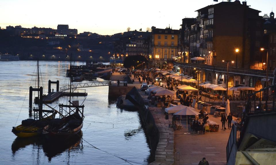 CORRECT SPELLING OF RIVER TO DOURO - This Feb. 16, 2017 photo shows the waterfront Ribeira district along the Douro River in Porto, Portugal. The river separates Porto from Vila Nova de Gaia, where the famous port wine caves are located. (Albert Stumm via AP)