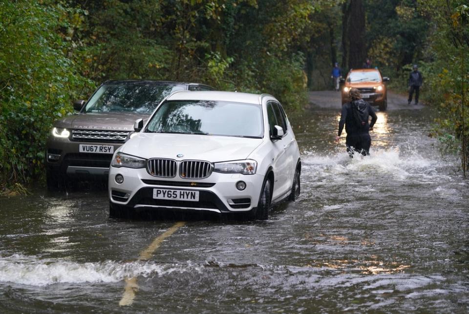 A broken down car in floodwater near Derwentwater, Keswick (Owen Humphreys/PA) (PA Wire)