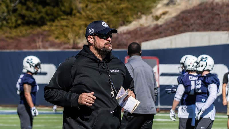 TJ Woods served as Utah State’s offensive line coach during the 2011-12 season. He will join the BYU coaching staff at the end of the year.