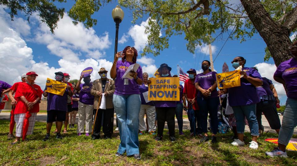 Margarette Nerette speaks to the media as Members of 1199SEIU United Healthcare Workers East held a protest against unsafe staffing levels at nursing homes in Southwest Florida Wednesday, June 8, 2022. They were joined by members of AARP. The protest was held outside of Raydiant Healthcare in North Fort Myers. 