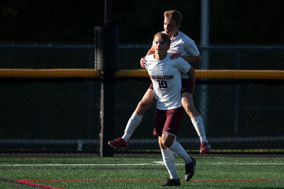 Abington seniors Liam Hartman, left, and Luke Odonnell cheer after a goal following a penalty kick at Hatboro-Horsham Senior High School on Tuesday, Oct. 11, 2022. The Ghosts defeated the Hatters 2-0.