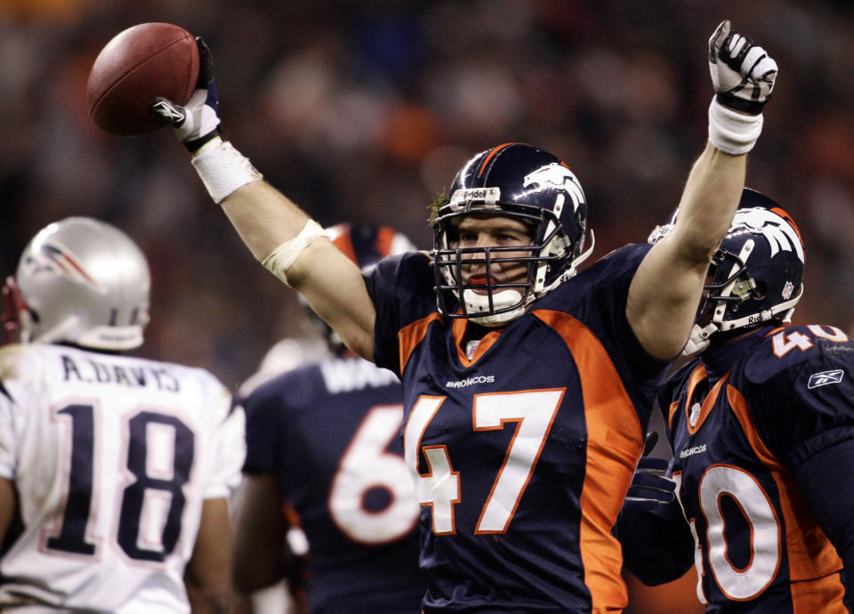 FILE - In this Jan. 14, 2006, file photo, Denver Broncos safety John Lynch celebrates an interception against the New England Patriots during the fourth quarter of an AFC divisional playoff game at Invesco Field at Mile High in Denver. Lynch was selected as a finalist for the Pro Football Hall of Fame's class of 2021 on Tuesday, Jan. 5, 2021. (AP Photo/Jack Dempsey, File)