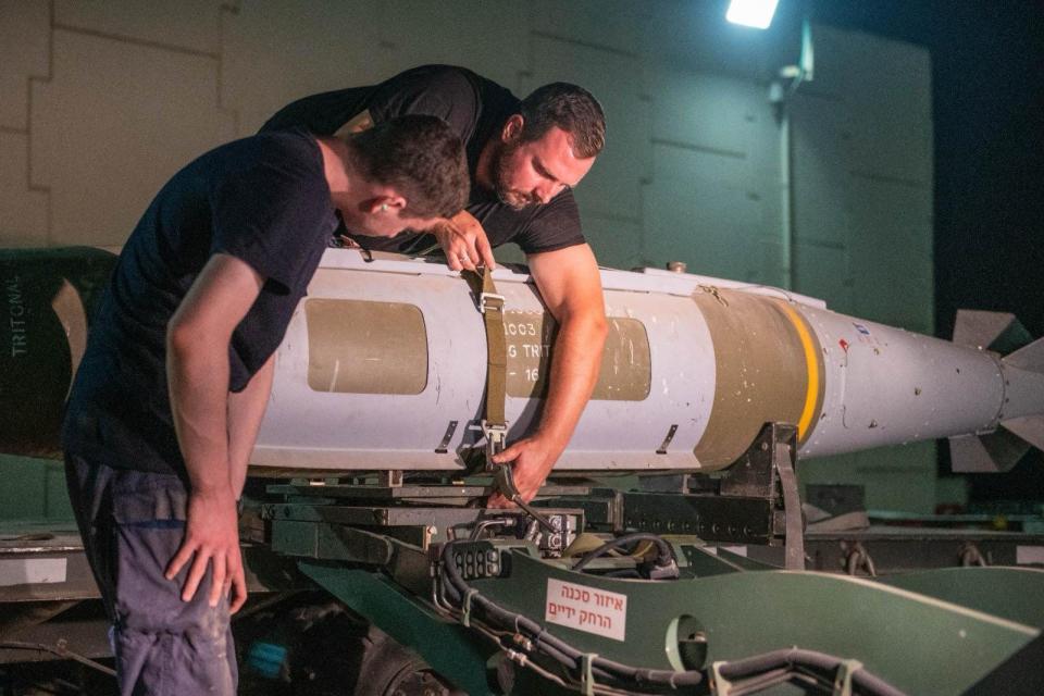 Israeli Air Force personnel working with a JDAM