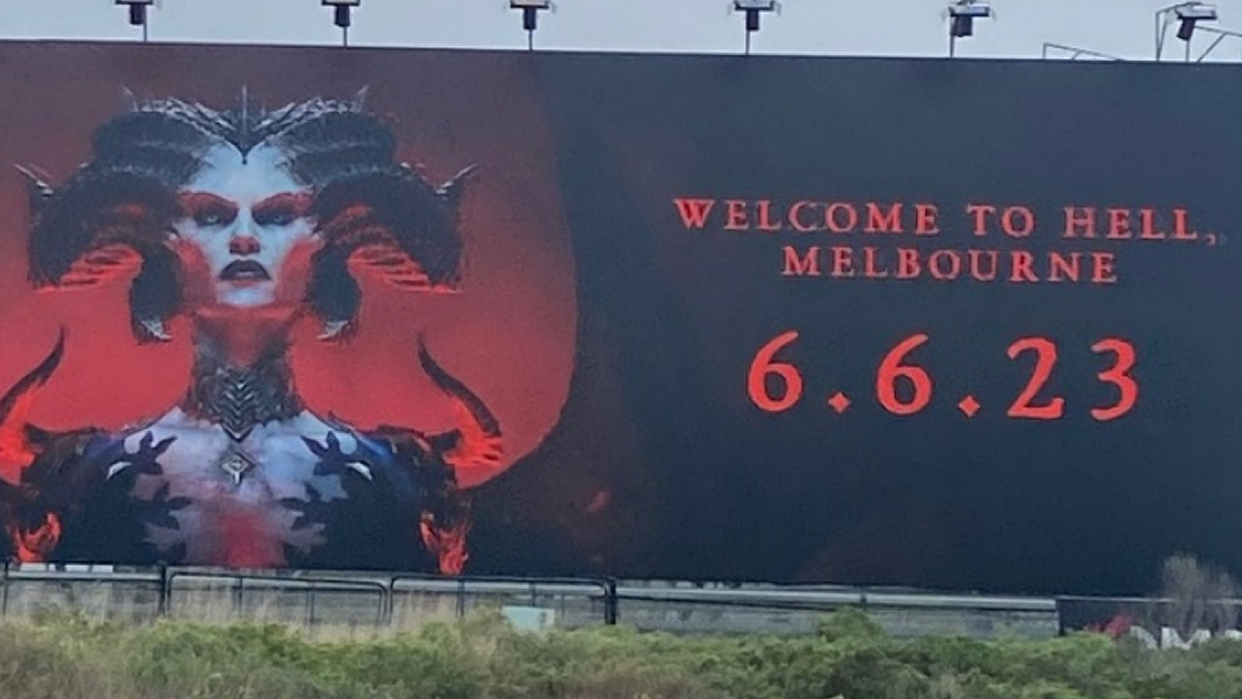 A billboard of Lilith, a horned devilish antagonist from Diablo 4, looming at the viewer, with the words: "Welcome to Hell, Melbourne" to the right of her. 