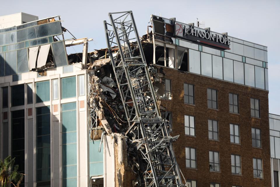 The building hit by this crane, seen Thursday in St. Petersburg, Florida, was home to the Tampa Bay Times, its reporters said. (REUTERS/Octavio Jones)