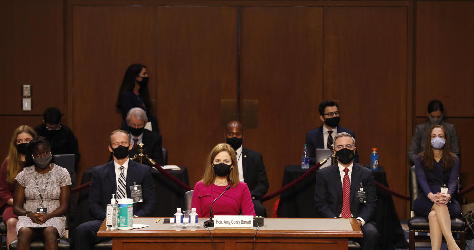 Supreme Court nominee Amy Coney Barrett arrives to her Senate Judiciary Committee confirmation hearing on Capitol Hill in Washington, Monday, Oct. 12, 2020. (Shawn Thew/Pool via AP)