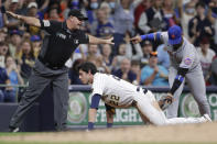 Milwaukee Brewers' Christian Yelich (22) slides safely into third base past the tag of New York Mets' Jonathan Villar, right, for a triple during the fifth inning of a baseball game Friday, Sept. 24, 2021, in Milwaukee. (AP Photo/Aaron Gash)