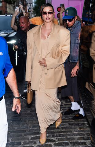 <p>Gotham/GC Images</p> Hailey Bieber attends Rhode's pop-up event in New York City