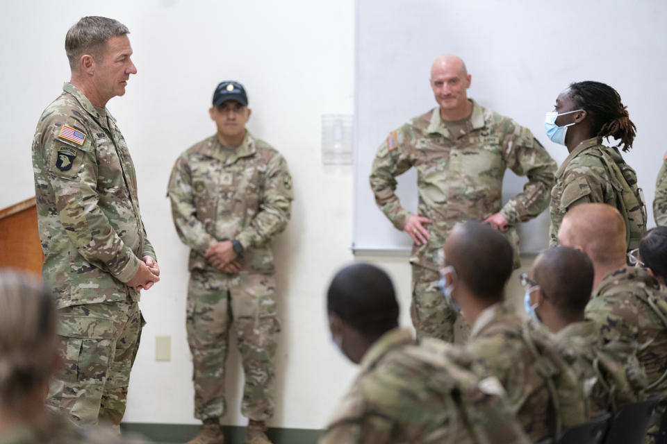 FILE - Chief of Staff of the Army Gen. James McConville left, listens to Daysia Holiday, a student in the Future Soldier Prep Course, right, at Fort Jackson in Columbia, S.C. Aug. 26, 2022. (AP Photo/Sean Rayford, File)