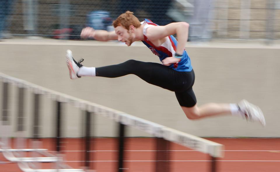 Fort LeBoeuf High School senior Hayden Skinner wins his preliminary heat in the 110-meter hurdles during the Harbor Creek track and field invitational at Paul J. Weitz Stadium in Harborcreek Township on April 23, 2022. 