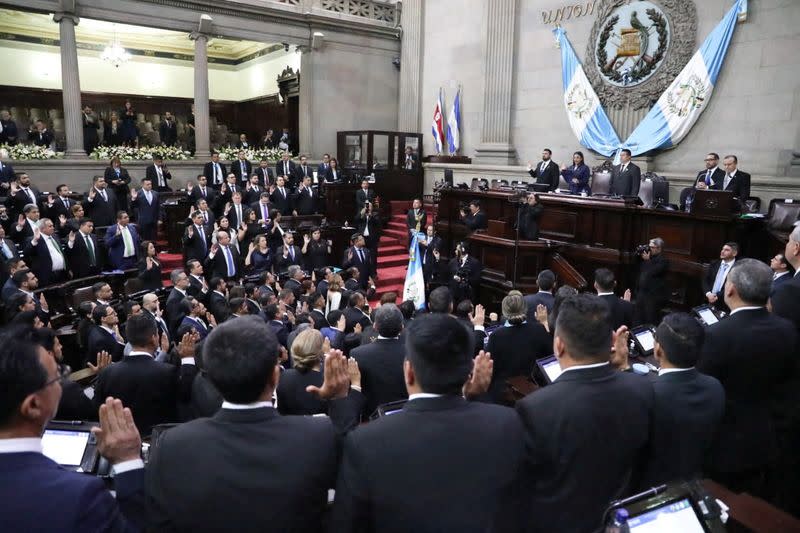 Guatemalan Congress representatives take the oath during inauguration day of President-elect Bernardo Arevalo, in Guatemala City