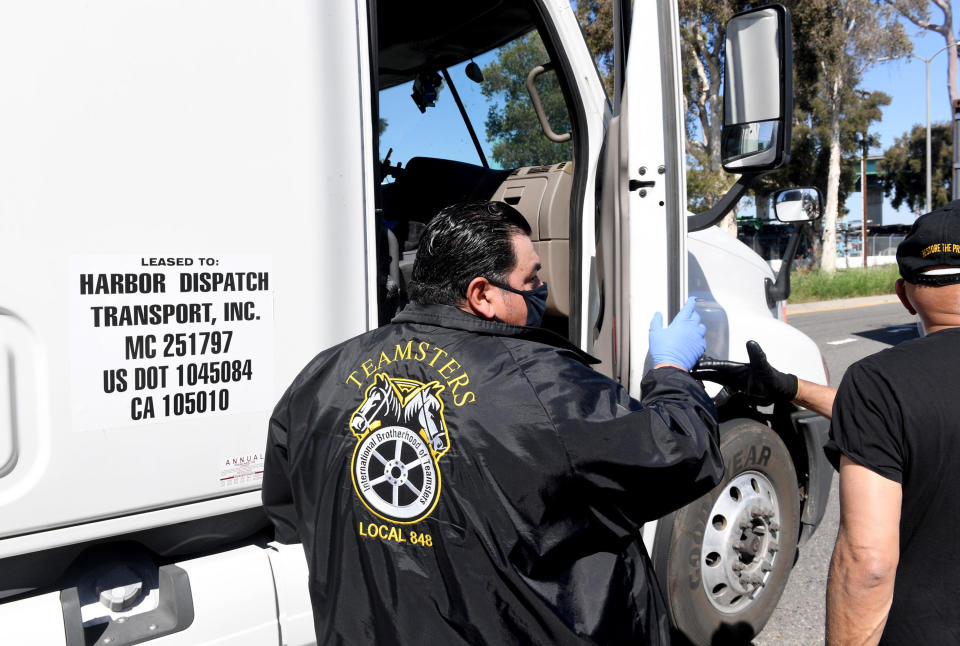 The Teamsters Port Division, in collaboration with Labor Community Services and the Los Angeles Regional Food Bank hosts a food distribution for port truck drivers impacted by the coronavirus shutdown measures at the Port of Los Angeles on April 22, 2020 in San Pedro, California. / Credit: Kevin Winter  / Getty Images