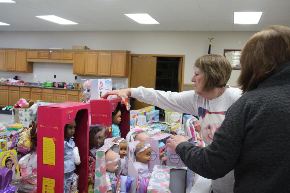 Linda Andorf and Sharon Ulrich pick out toys on Monday, Dec. 5, 2022, for the annual toy drive.