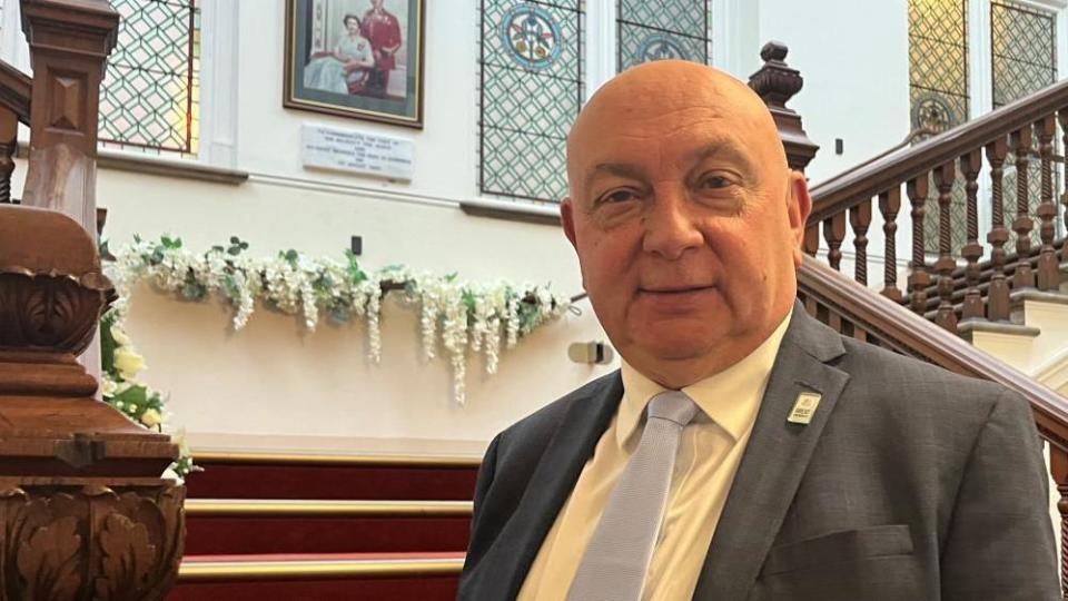 Councillor Carl Smith on the stairs at Great Yarmouth Town Hall