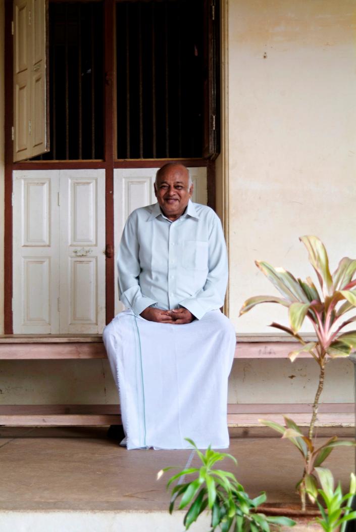 Owner Annamalai Chandramouli poses for a photograph outside his family mansion in 2006, which was converted into a hotel.