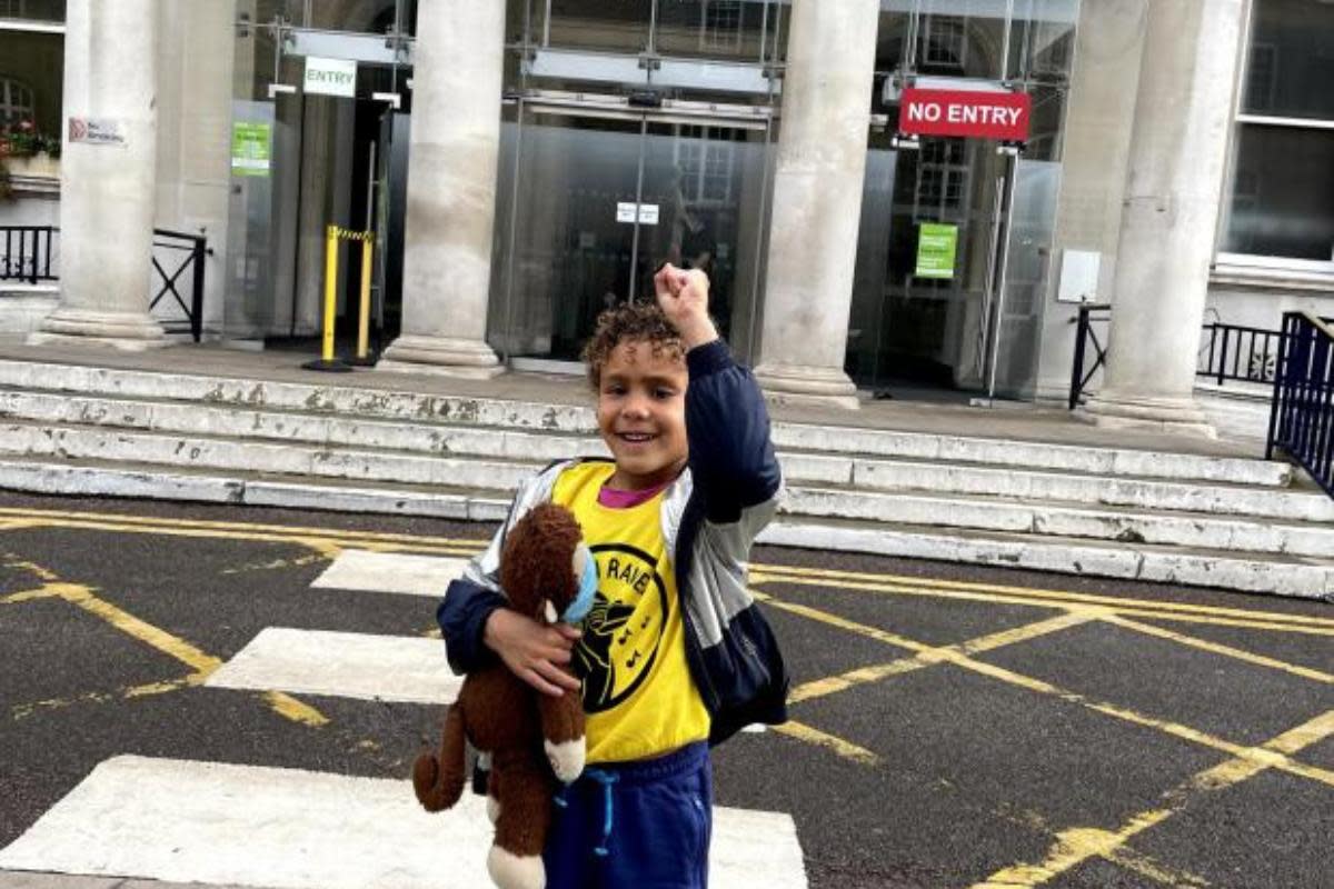 Ravi Adelekan outside hospital having been discharged from hospital <i>(Image: The Brain Tumour Charity)</i>