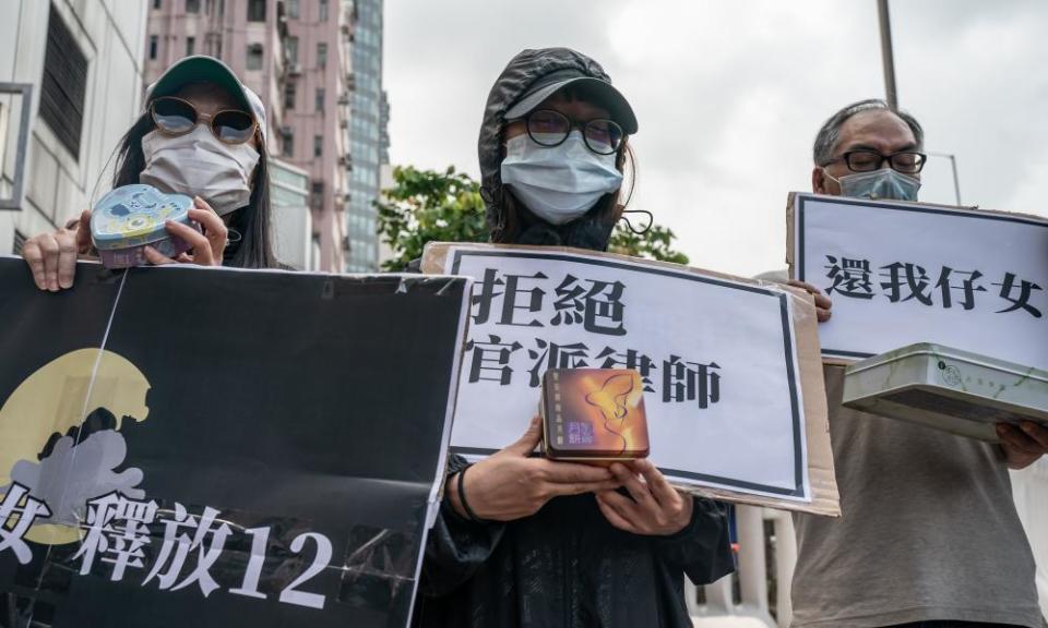 Family members of the Hong Kong residents detained in China protest outside the Liaison Office of the Central People’s Government on 30 September.