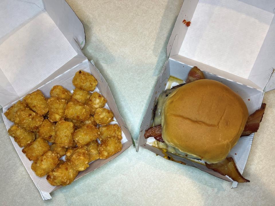 Tater tots and the O.F.D. burger from Wahlburgers, AKA takeout after a long week of work.