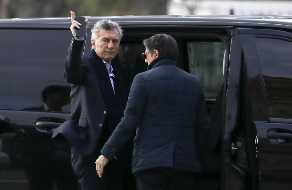 Argentina's President Mauricio Macri arrives to the government house in Buenos Aires, Argentina, Monday, Sept. 2, 2019. Argentina's government on Sunday decreed that Argentines will need authorization from the central bank to buy U.S. dollars in some cases and make transfers abroad for the rest of the year as it tries to prop up its peso currency. (AP Photo/Natacha Pisarenko)