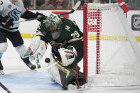 Minnesota Wild goaltender Marc-Andre Fleury (29) stops a Seattle Kraken shot during the second period of an NHL hockey game Thursday, April 18, 2024, in St. Paul, Minn. (AP Photo/Abbie Parr)