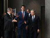 Interim President of Venezuela Juan Guaido waves as he arrives for a photo with Canada's Minister of Foreign Affairs Francois-Philippe Champagne in Ottawa, Ontario, Monday, Jan. 27, 2020. (Justin Tang/The Canadian Press via AP)